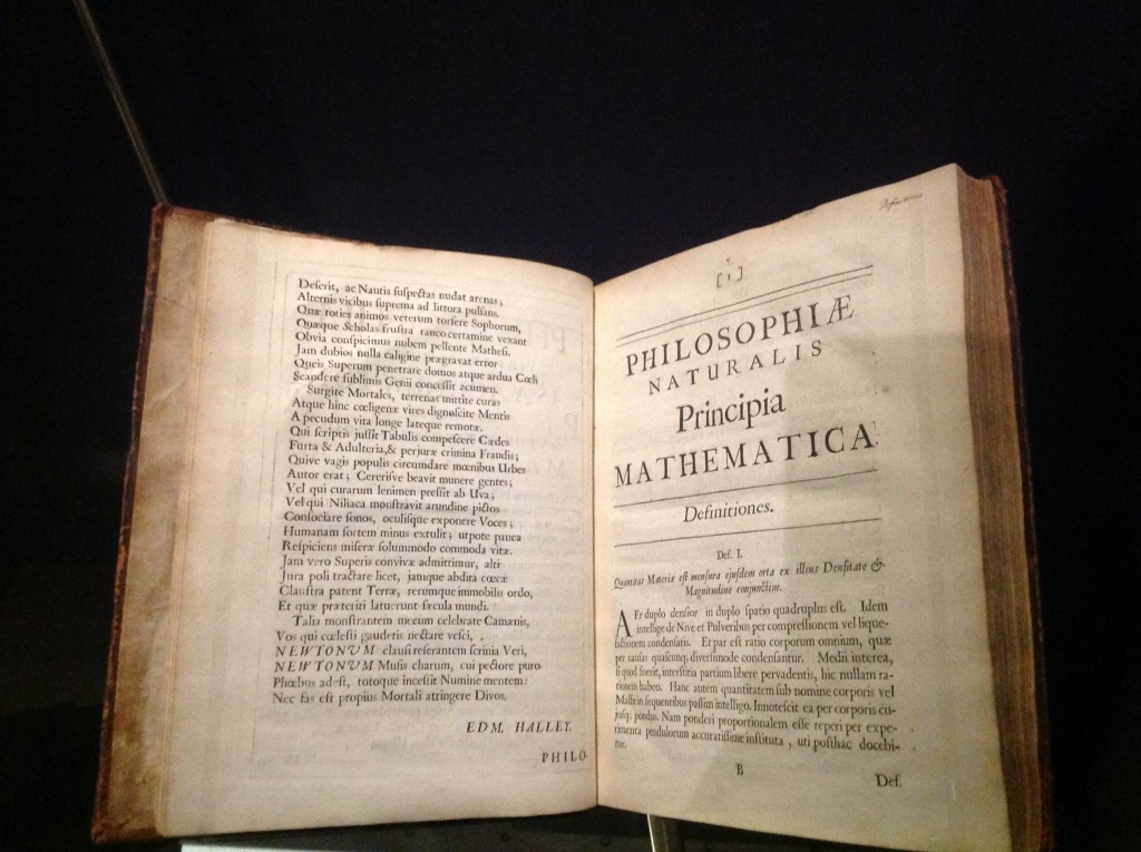 Newton's Principia, original Latin edition!  Edmond Halley, who persuaded Newton to publish, became the editor of the work, and wrote the poem on the left page to preface the text.