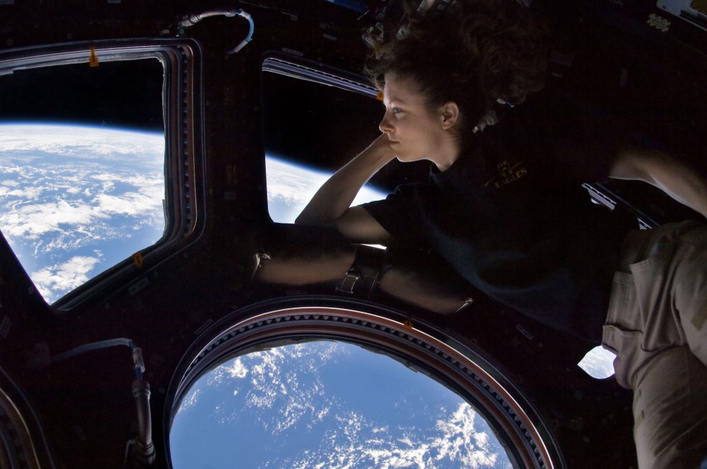 Astronaut Tracy Caldwell Dyson gazes down at Earth from the cupola onboard the International Space Station
